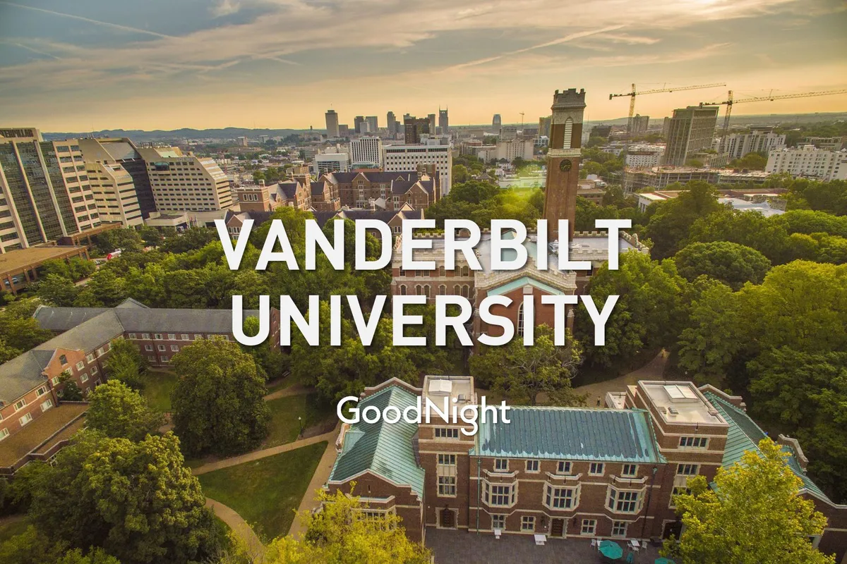 A peaceful, wide-angle view featuring Vanderbilt University’s iconic clock tower, surrounded by lush greenery and neighboring buildings, with the city skyline in the distance. The scene suggests a blend of academic tradition and urban vibrancy, highlighting a prominent business and academic landmark.