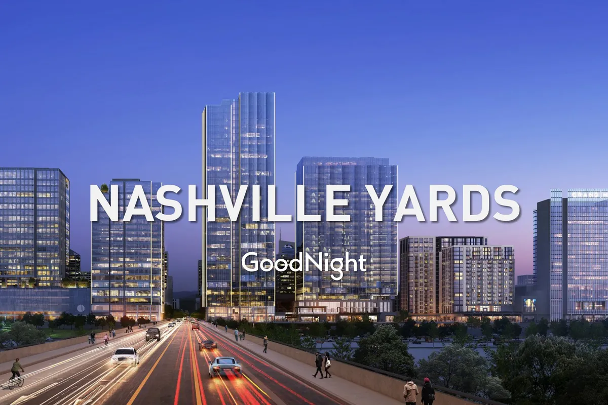 A dynamic evening streetscape of downtown Nashville, showcasing skyscrapers and lit-up roadways, with people out for the night. The city skyline and urban energy are visible, hinting at the bustling nightlife and entertainment scene.
